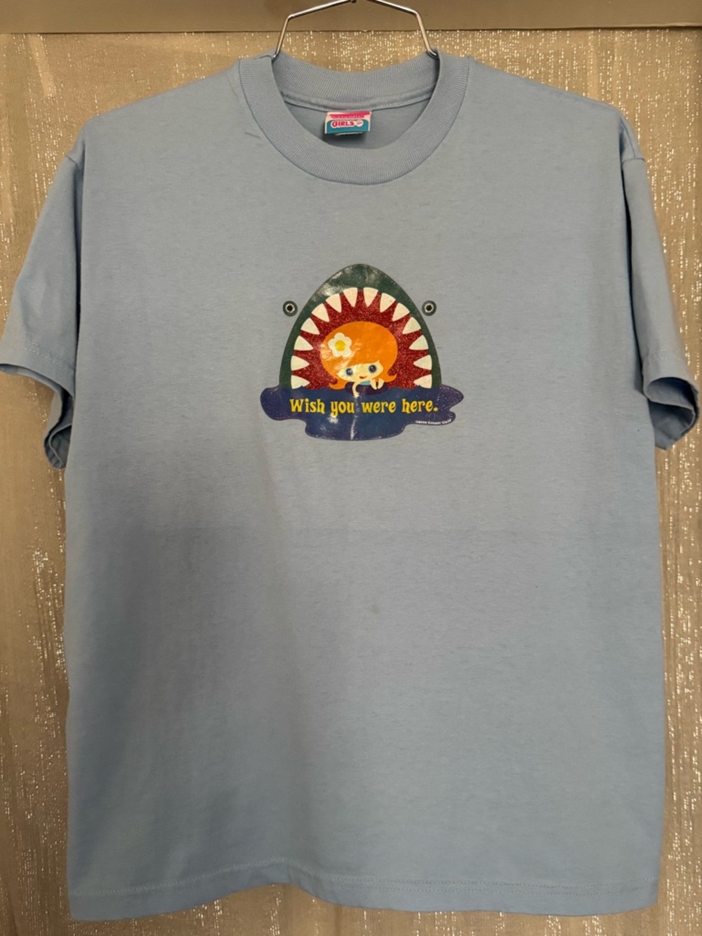 Women’s Light Blue Graphic Tee - 'Wish You Were Here' Featuring Oopsie Daisy